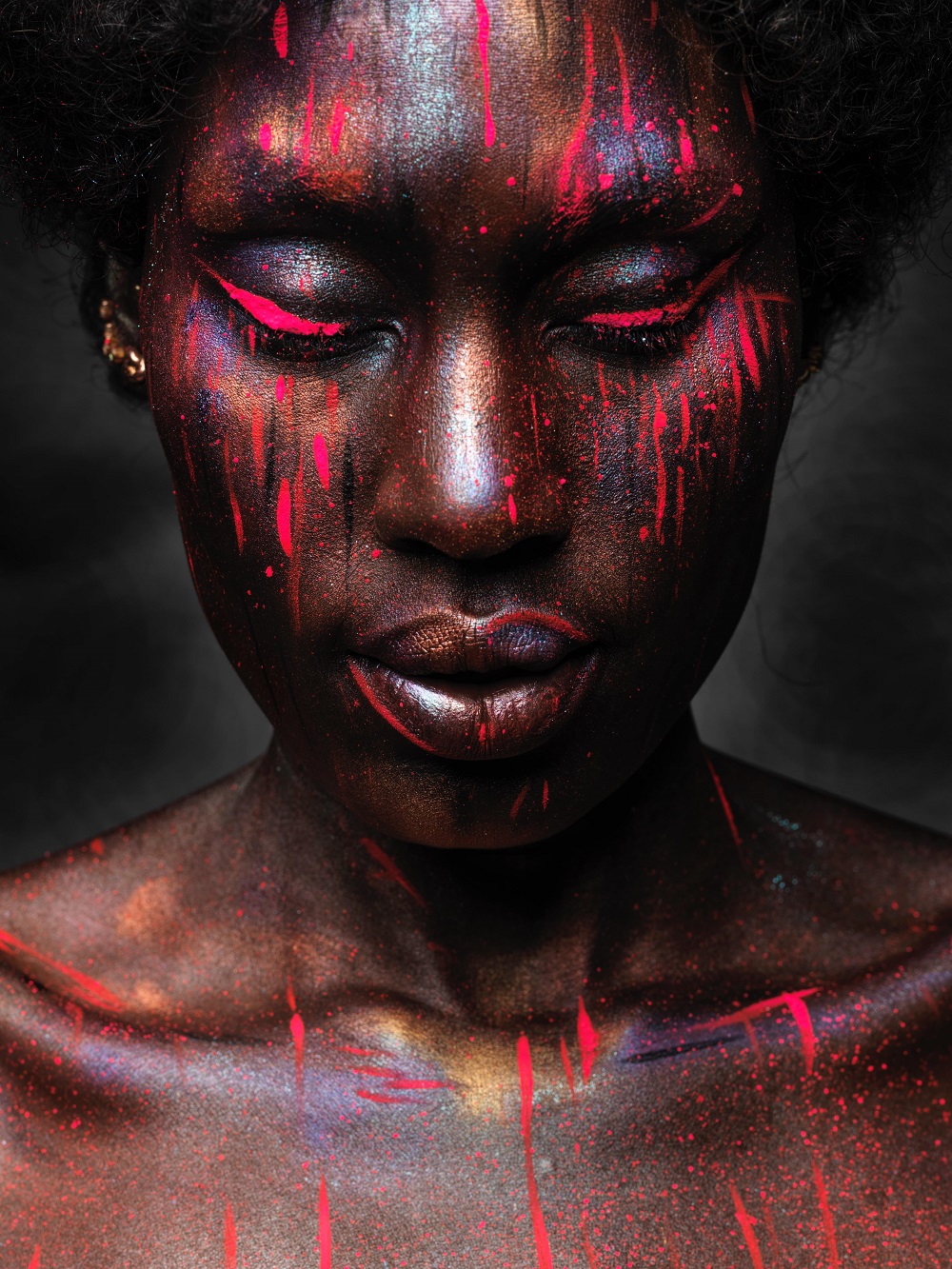 woman with red paint on her face