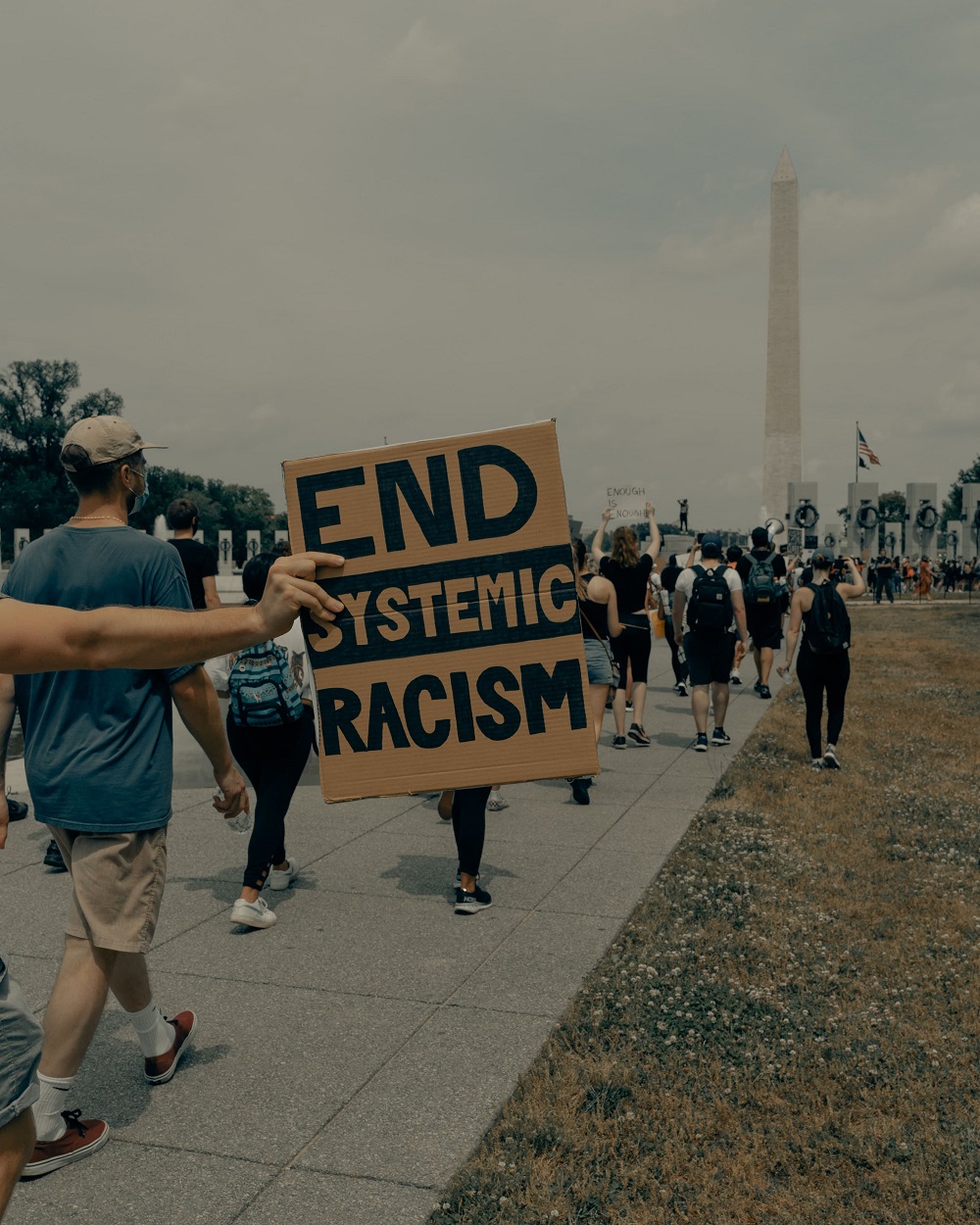 end systemic racism sign